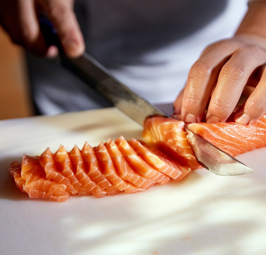 Cutting salmon sashimi